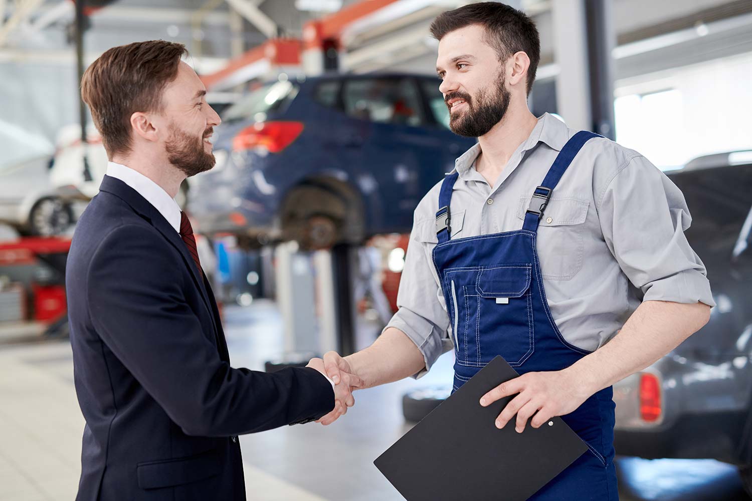 mechanic-shaking-hands-with-businessman-small.jpg